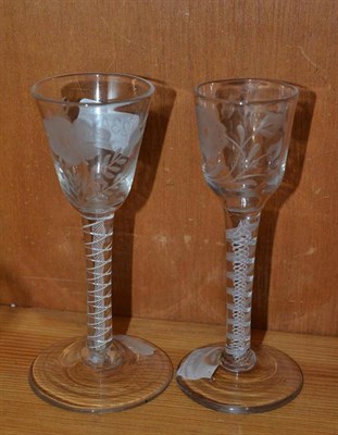 Lot 234 - An engraved wine glass, with opaque twist stem, conical foot and another with bird and flower...