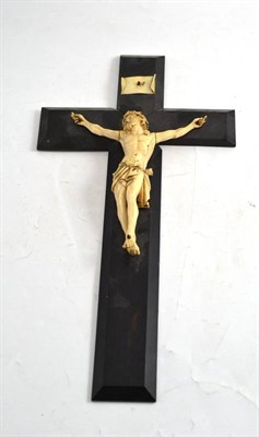 Lot 237 - A carved ivory figure of Christ on an ebonised crucifix