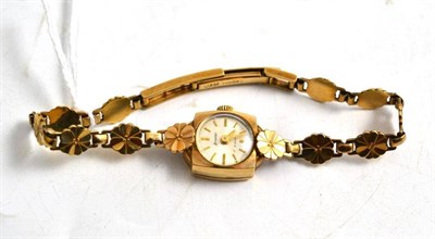 Lot 244 - A 9ct gold lady's Accurist wristwatch with floral bracelet