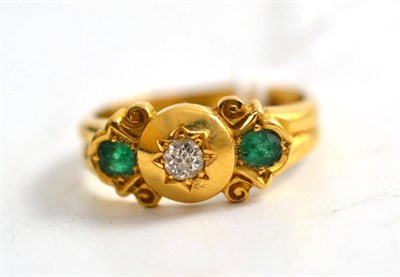 Lot 245 - An 18ct gold diamond and emerald three stone ring