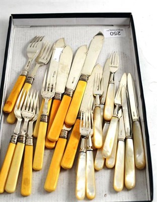 Lot 250 - A set of six silver bladed fish knives and forks with ivory handles and a set of six silver...