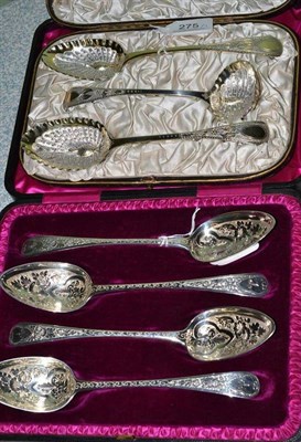 Lot 275 - A set of four cased silver, later decorated, Georgian spoons and a pair of berry spoons and a...