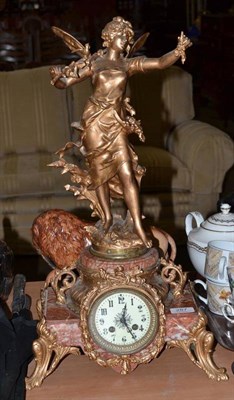 Lot 287 - A marble and spelter striking mantel clock, figural base stamped 'Moreau'