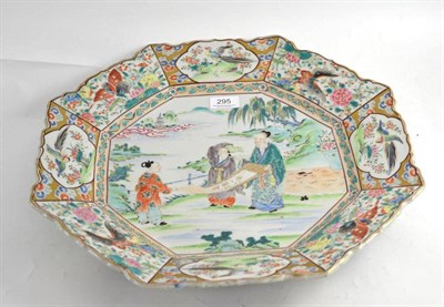 Lot 295 - A Japanese octagonal charger in the Chinese taste, decorated in famille rose enamels with...