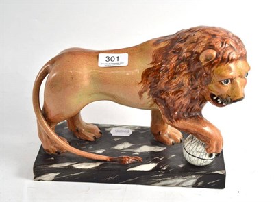 Lot 301 - An early 19th century pearlware figure of a lion