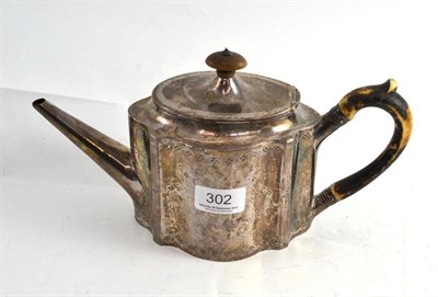 Lot 302 - A George III silver teapot and cover, London 1788