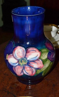 Lot 327 - A Moorcroft 'Clematis' pattern vase, 25cm high