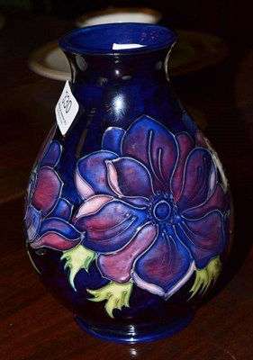 Lot 330 - A modern Moorcroft vase decorated with flowers, 17cm high