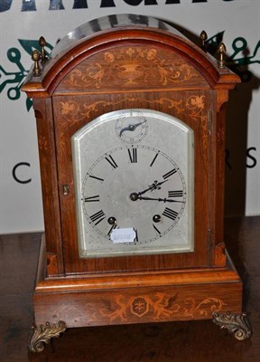 Lot 331 - A LenzKirch rosewood marquetry striking mantel clock