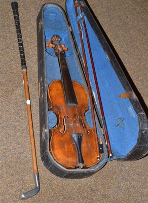 Lot 349 - A 19th century German violin with two bows, cased, and a Rangefinder 'Bunny' golf iron (2)