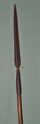 Lot 352 - A West African spear, the long narrow leaf shape socket blade with raised medial ridge, on a...