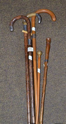 Lot 354 - Six assorted walking sticks and swagger sticks (6)