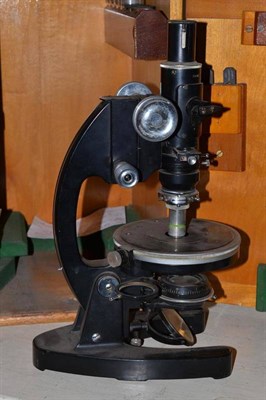 Lot 358 - A black enamelled monocular compound microscope by Cooke, Troughton & Simms, No.M102974, with...