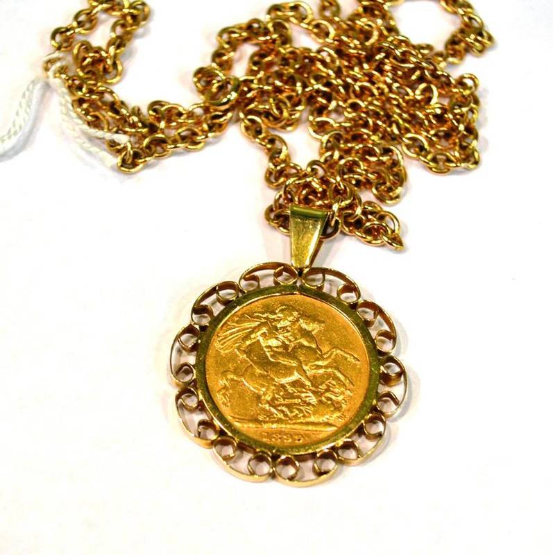 Lot 380 - A Victorian (1899) sovereign loose mounted in a 9ct gold pendant on a fancy link chain