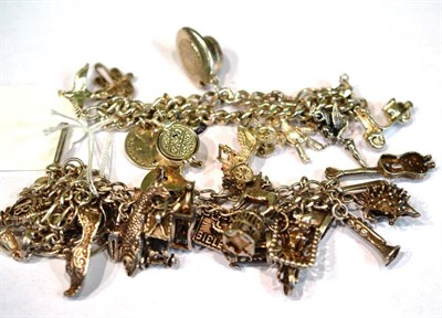 Lot 391 - Two silver charm bracelets