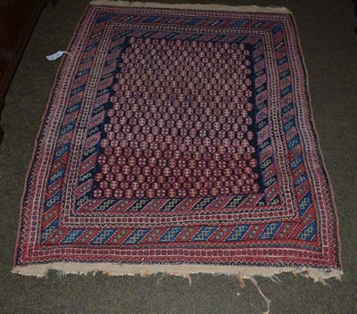 Lot 488 - Afshar rug, South East Persia, the indigo honeycomb lattice field enclosed by multiple borders,...