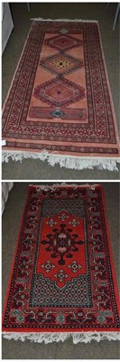 Lot 491 - Two oriental rugs, one 70cm by 138cm, the other 98cm by 185cm