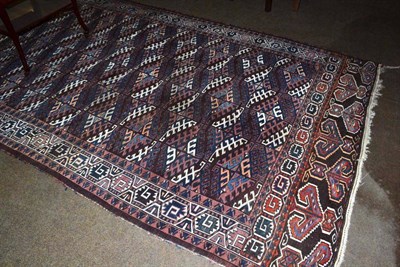 Lot 494 - Yomut carpet, Emirate of Bukhara, the chocolate field with lattice of guls enclosed by borders...