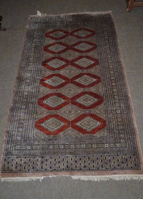 Lot 496 - Cream ground rug