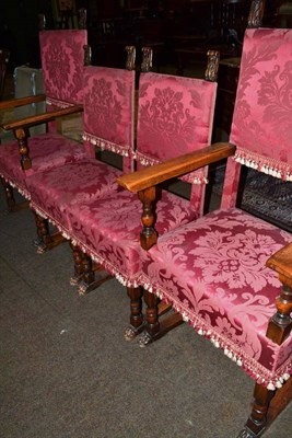 Lot 497 - A set of four oak framed high back chairs with paw feet and pink brocade upholstery