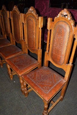 Lot 501 - Set of eight Spanish style dining chairs with leather seats