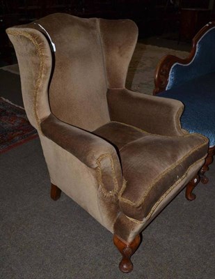 Lot 511 - A late Victorian wing back chair, late 19th/early 20th century, recovered in brown velvet, with...