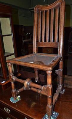 Lot 515 - An oak side chair and an African chair