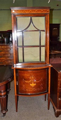 Lot 516 - Edwardian inlaid mahogany display cabinet on bow fronted base