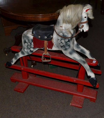 Lot 546 - A child's dapple grey rocking horse