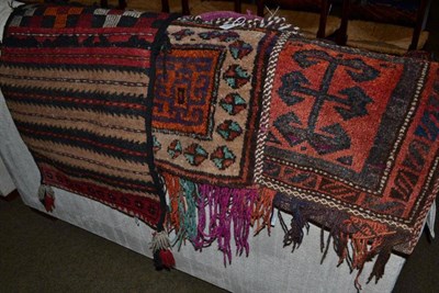 Lot 550 - An Afghan saddle bag, North Afghanistan, the madder field of geometric design enclosed by...