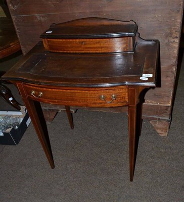 Lot 554 - An Edwardian mahogany writing desk with leather top