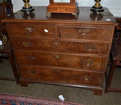 Lot 559 - A George III oak four height chest of drawers