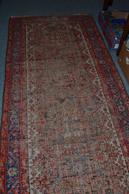 Lot 628 - A pink ground runner (very worn)