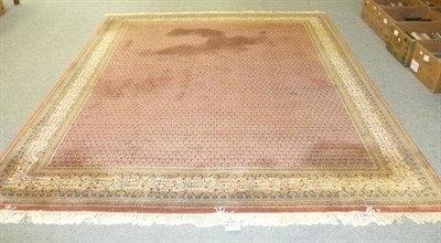 Lot 713 - Indian carpet of Serabend design, the rust field of boteh enclosed by ivory borders, 296cm by 253cm