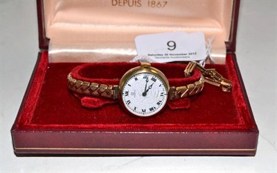 Lot 9 - A 9ct gold Omega watch with later strap and a 9ct gold Longines watch