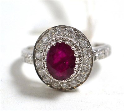 Lot 53 - A 9ct white gold ruby and diamond cluster ring