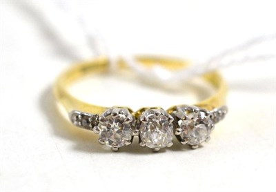 Lot 55 - A diamond three stone ring, circa 1930, stamped '18CTPLAT', total estimated diamond weight 0.60...