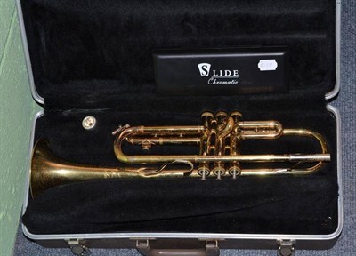 Lot 118 - A Buescher brass trumpet in hard case and a slide mouthorgan