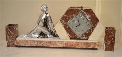 Lot 125 - An Art Deco marble mantel timepiece with garniture