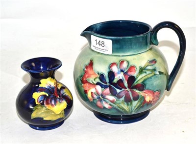 Lot 148 - A Moorcroft jug and a small Moorcroft vase