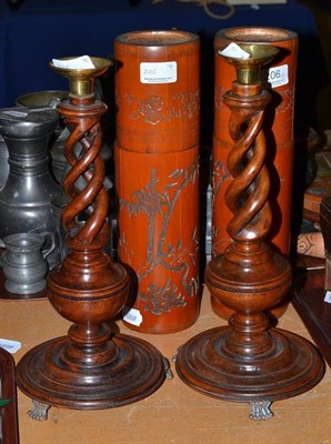 Lot 206 - A pair of turned wood candlesticks, brass sconces and a pair of bamboo jars