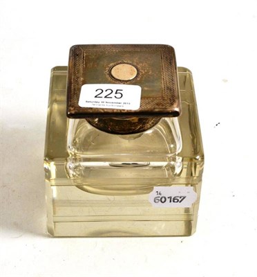 Lot 225 - A large cut glass inkwell with silver mounts