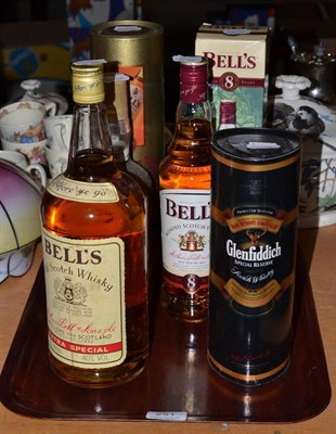 Lot 251 - A Christmas parcel of whisky comprising: Bells 1.5litre, Bells 8 Year Old (x3), Southern...