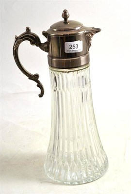 Lot 253 - A large claret jug with moulded body and silver plated mounts