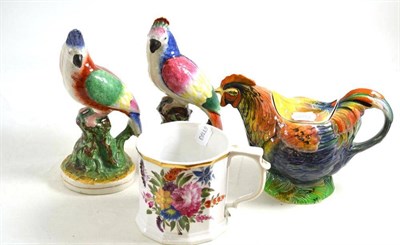 Lot 254 - Pair of Staffordshire parrots, cockerel teapot and a mug