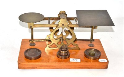 Lot 272 - A large Samson Morden brass postal scale, on oak base with various weights