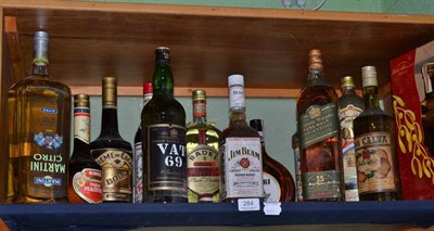 Lot 284 - A Christmas parcel of spirits including; a litre of Johnnie Walker 15 year old Scotch whisky,...