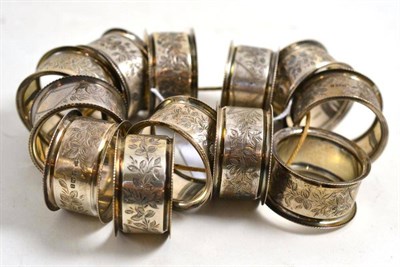 Lot 295 - Set of twelve silver napkin rings