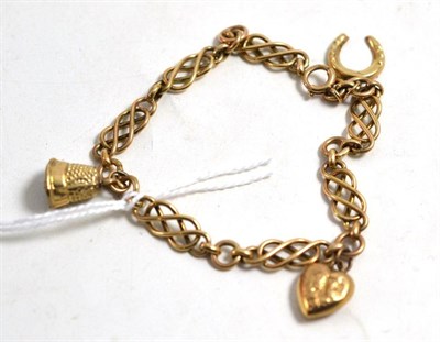 Lot 308 - A 9ct gold fancy link charm bracelet