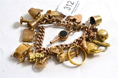 Lot 312 - A 9ct gold curb link bracelet, hung with charms